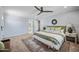 Relaxing bedroom featuring a ceiling fan, a decorative rug, and soothing neutral colors at 538 W Las Palmaritas Dr, Phoenix, AZ 85021