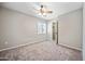 Empty bedroom with window and ceiling fan, ready for your personal touch at 538 W Las Palmaritas Dr, Phoenix, AZ 85021
