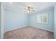 Bright, vacant bedroom with a ceiling fan and natural light from the shuttered window at 538 W Las Palmaritas Dr, Phoenix, AZ 85021