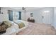 Primary bedroom with a ceiling fan, neutral colors, and large front door at 538 W Las Palmaritas Dr, Phoenix, AZ 85021