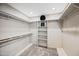 Spacious walk-in closet offering ample shelving and storage options at 538 W Las Palmaritas Dr, Phoenix, AZ 85021