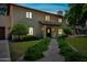Two-story home featuring manicured bushes lining the walkway to the front door at 538 W Las Palmaritas Dr, Phoenix, AZ 85021