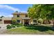 Inviting two-story home featuring a lush green lawn and mature trees at 538 W Las Palmaritas Dr, Phoenix, AZ 85021