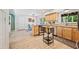 Well-lit kitchen with wooden cabinetry, granite countertops, and a functional center island for food preparation at 538 W Las Palmaritas Dr, Phoenix, AZ 85021