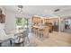 Bright kitchen featuring stainless steel appliances, a breakfast bar, and a view of the backyard pool area at 538 W Las Palmaritas Dr, Phoenix, AZ 85021