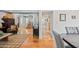 Cozy living room with hardwood floors, comfortable seating, and a view of the home's staircase and entry at 538 W Las Palmaritas Dr, Phoenix, AZ 85021