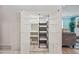 Walk-in pantry with pull out shelves and baskets, providing ample storage space at 538 W Las Palmaritas Dr, Phoenix, AZ 85021