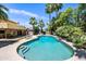 Inviting backyard pool with steps, surrounded by lush landscaping and palm trees, creating a resort-like atmosphere at 538 W Las Palmaritas Dr, Phoenix, AZ 85021