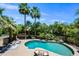 Aerial view of the backyard pool featuring lounge chairs and lush landscaping at 538 W Las Palmaritas Dr, Phoenix, AZ 85021