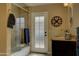 Bathroom with a glass-enclosed shower, vanity, and access to the backyard at 5431 E Piping Rock Rd, Scottsdale, AZ 85254