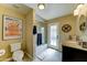 Well-lit bathroom with modern fixtures, shower, and outdoor access, providing convenience and style at 5431 E Piping Rock Rd, Scottsdale, AZ 85254