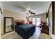 Inviting bedroom with ceiling fan, patio access, and plenty of natural light, creating a relaxing space at 5431 E Piping Rock Rd, Scottsdale, AZ 85254