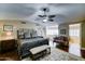 Primary bedroom boasts vaulted ceiling, hardwood floors and refined decor at 5431 E Piping Rock Rd, Scottsdale, AZ 85254