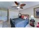 Comfortable bedroom featuring a ceiling fan, ample closet space, and a neutral color palette at 5431 E Piping Rock Rd, Scottsdale, AZ 85254