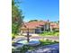 Beautiful single-Gathering home featuring a meticulously landscaped front yard and charming fountain in the circular driveway at 5431 E Piping Rock Rd, Scottsdale, AZ 85254