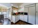 Kitchen featuring stainless appliances, stone countertops, tile backsplash, and windows with roman shades at 5431 E Piping Rock Rd, Scottsdale, AZ 85254