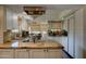 Bright kitchen featuring granite countertops, white cabinets, stainless steel appliances, and eat-in dining area at 5431 E Piping Rock Rd, Scottsdale, AZ 85254