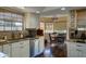 Beautiful kitchen featuring granite countertops, white cabinets, stainless steel appliances, and hardwood floors at 5431 E Piping Rock Rd, Scottsdale, AZ 85254