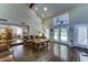 Bright living room boasting high ceilings, skylights, hardwood flooring, and doors leading to backyard at 5431 E Piping Rock Rd, Scottsdale, AZ 85254
