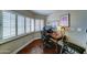 Office featuring hardwood floors, desk, and window with shutters at 5431 E Piping Rock Rd, Scottsdale, AZ 85254