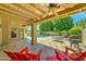 Covered outdoor patio with poolside seating and a barbecue grill at 5431 E Piping Rock Rd, Scottsdale, AZ 85254