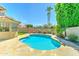 Backyard pool with a stone surround and mature landscaping at 5431 E Piping Rock Rd, Scottsdale, AZ 85254