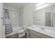 Clean bathroom featuring a shower-tub combo with white marble patterned tiles and a vanity sink at 600 W Grove Pkwy # 2188, Tempe, AZ 85283