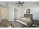 Comfortable bedroom with neutral color palette, ceiling fan and wood-look flooring at 600 W Grove Pkwy # 2188, Tempe, AZ 85283