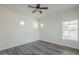 Bright bedroom featuring a ceiling fan, wood-look flooring, and decorative accent windows at 600 W Grove Pkwy # 2188, Tempe, AZ 85283