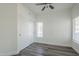 Bedroom featuring wood-look flooring, a ceiling fan, closet and a large window for lots of light at 600 W Grove Pkwy # 2188, Tempe, AZ 85283