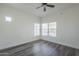 Clean, bright bedroom featuring wood-look flooring and two large windows for ample natural light at 600 W Grove Pkwy # 2188, Tempe, AZ 85283