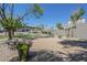 Relaxing community area with beautiful landscaping, bench, and manicured gravel at 600 W Grove Pkwy # 2188, Tempe, AZ 85283