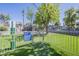 Dog park with a turfed area, trees, and community guidelines on display at 600 W Grove Pkwy # 2188, Tempe, AZ 85283