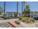 The info center for the community is framed by tall palm trees and professionally landscaped grounds at 600 W Grove Pkwy # 2188, Tempe, AZ 85283