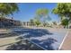Community tennis court featuring well-maintained court and surrounding trees at 600 W Grove Pkwy # 2188, Tempe, AZ 85283