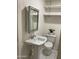 Bathroom features a pedestal sink, open shelving, and a toilet at 632 W Fordham Dr, Tempe, AZ 85283