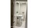 Bright bathroom with pedestal sink, mirror, and toilet at 632 W Fordham Dr, Tempe, AZ 85283