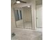 Bedroom featuring mirrored closet doors and tile flooring at 632 W Fordham Dr, Tempe, AZ 85283