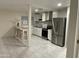 Well-lit kitchen featuring stainless steel appliances, white cabinets, and tiled backsplash at 632 W Fordham Dr, Tempe, AZ 85283