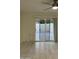 Room view of the tiled floor and sliding glass door to an enclosed outdoor patio at 632 W Fordham Dr, Tempe, AZ 85283