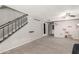 Bright living room features tile floors, fan, stairs, and neutral color scheme at 7126 N 19Th Ave # 152, Phoenix, AZ 85021