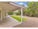 Covered patio area with a view of the gravel backyard and mature landscaping at 8411 E Via De Jardin --, Scottsdale, AZ 85258