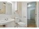 Clean half-bathroom with white fixtures and a classic design at 8411 E Via De Jardin --, Scottsdale, AZ 85258