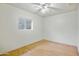 Bright bedroom showcasing a window view with hardwood style flooring at 8411 E Via De Jardin --, Scottsdale, AZ 85258