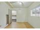 Bedroom with an open door leading to a kitchen with white cabinetry at 8411 E Via De Jardin --, Scottsdale, AZ 85258