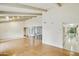 Open concept living room with hardwood floors and access to the kitchen at 8411 E Via De Jardin --, Scottsdale, AZ 85258