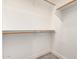 Walk-in closet with carpeted floor and wood shelving at 955 E Knox Rd # 126, Chandler, AZ 85225
