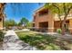 Exterior shot of a multi-story apartment building with well-maintained landscaping at 955 E Knox Rd # 126, Chandler, AZ 85225