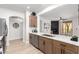 Open-concept kitchen with stainless steel appliances and sleek countertops offering easy flow to living area at 955 E Knox Rd # 126, Chandler, AZ 85225