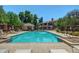Community pool area with lounge chairs, cabana and trees at 955 E Knox Rd # 126, Chandler, AZ 85225